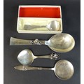 A collection of four Danish silver spoons, comprising a Georg Jensen Sterling silver commemorative s... 