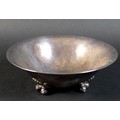 A Danish Sterling silver bowl of circular lobed form, raised on three feet, each shaped as a pair of... 