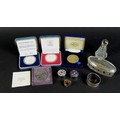 A collection of silver items and coins, including two dressing table items, a scent bottle with whit... 
