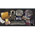 A collection of silver plated wares, including a Mappin & Webb twin handled wine holder decorated wi... 