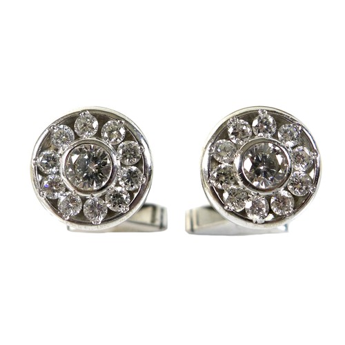 414 - A pair of gentleman's 18ct white gold and diamond cufflinks, together with three matching shirt stud... 