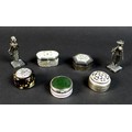 A group of five silver and white metal pill boxes, including an Art Deco silver cylindrical box, the... 