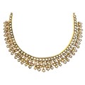 An 18ct gold and seed pearl fringed collerette necklace, likely 19th century, with quatrefoil and ha... 