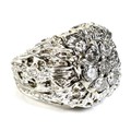 An American 14K white gold over yellow gold diamond cluster ring, of unusual modernist design, circa... 