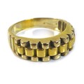 A yellow gold gentleman's ring, with modern sectional design, previously resized, marks rubbed but t... 