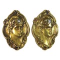 A pair of Art Nouveau unmarked yellow gold cufflinks, each of oval form, cast in relief with a young... 