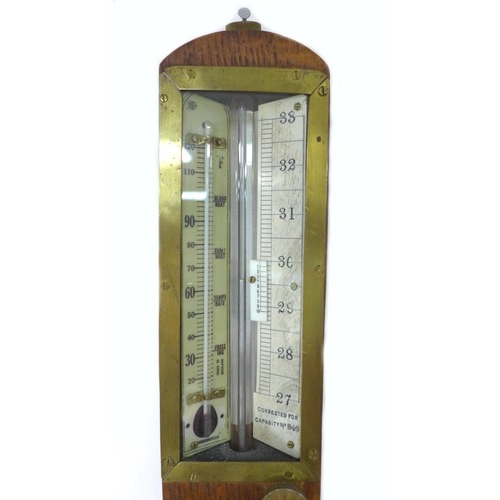 307 - An early 20th century oak wall barometer, marked ‘Corrected for Capacity No 849, Annan, London’, 9 b... 