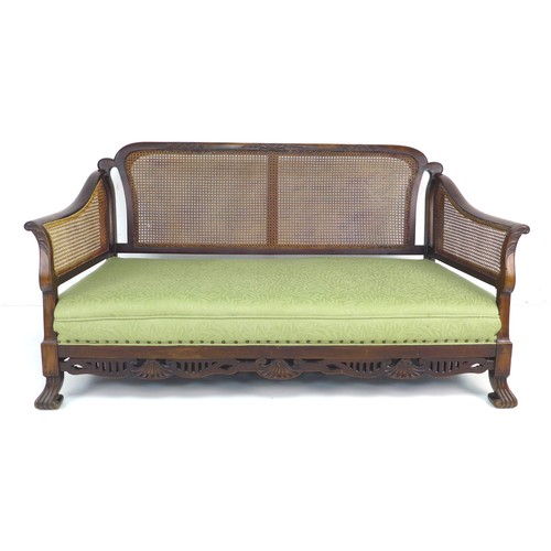 289 - An Edwardian mahogany bergere three piece suite, comprising a three seater settee, 165 by 85 by 84cm... 