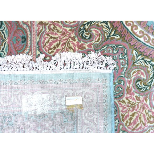 313 - A modern Persian carpet, Heriz or Keshan, with pale green ground, white and pink decoration, 500 by ... 