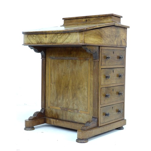 304 - A late Victorian walnut Davenport, with marquetry inlaid top, a leather inset to its writing slope, ... 