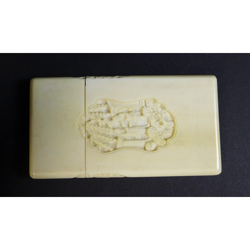 10 - A group of three late 19th / early 20th century Chinese ivory items comprising a card case, the cent... 