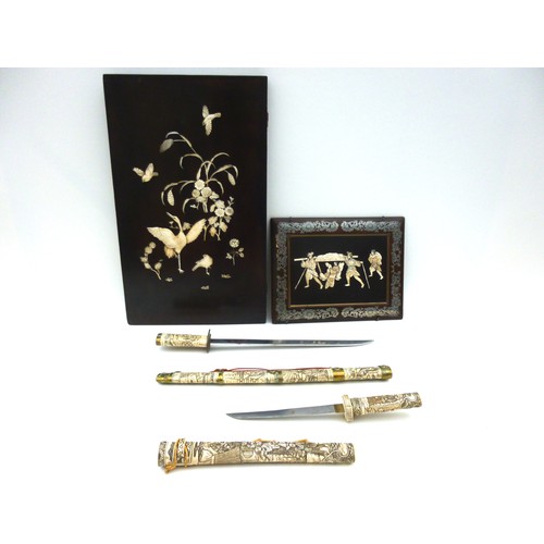 7 - A reproduction Japanese sword or wakizashi in ornately carved bone saya, with matching tsuka, with b... 