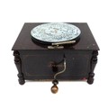 An open topped Premier mahogany cased polyphon for eight and a half inch discs, with winder, 28 by 3... 