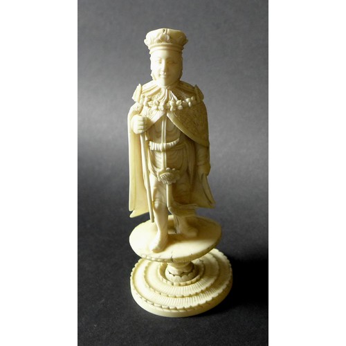 18 - A group of four late 19th /early 20th century ivory figures, comprising an okimono of a fisherman on... 
