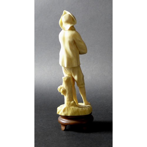 18 - A group of four late 19th /early 20th century ivory figures, comprising an okimono of a fisherman on... 