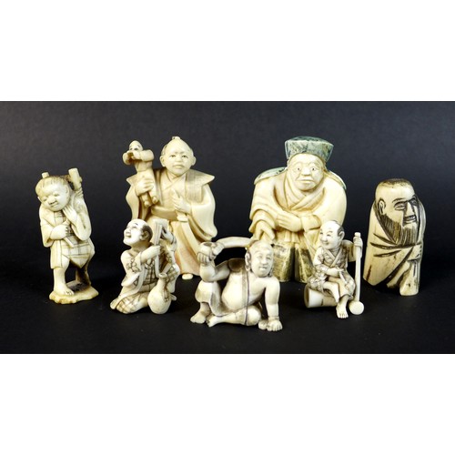 16 - A group of Japanese Meiji period ivory figures comprising three netsuke, one of a gentleman with a s... 