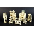 A group of Japanese Meiji period ivory figures comprising three netsuke, one of a gentleman with a s... 