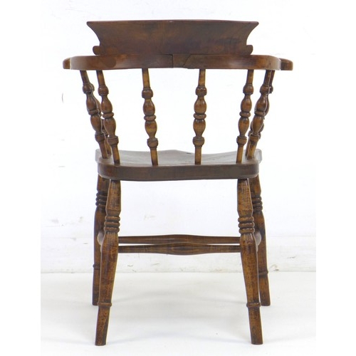 309 - A 19th century burr oak and elm smoker's bow armchair, with shaped arms supported on turned spindles... 