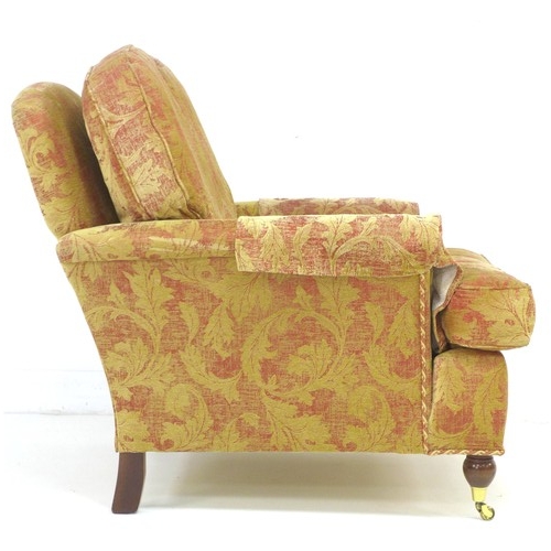 291 - A modern three piece suite, red and gold foliate upholstery, comprising a three / four seater sofa, ... 