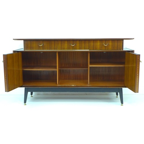 296 - A retro G-Plan E. Gomme sideboard, circa 1958, tola and black sideboard, model T914, with three draw... 