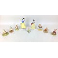 A group of nine  Royal Doulton Disney Snow White and the seven Dwarfs figurines, modelled as Snow Wh... 