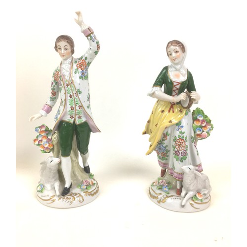 40 - A group of English and Continental figurines, comprising a 19th century Staffordshire flatback figur... 