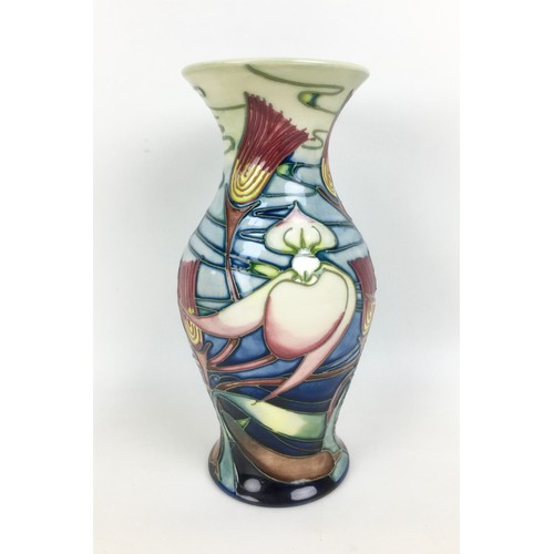 26 - A Moorcroft pottery vase in slipper orchid pattern, of baluster form, with impressed marks, dated 20... 
