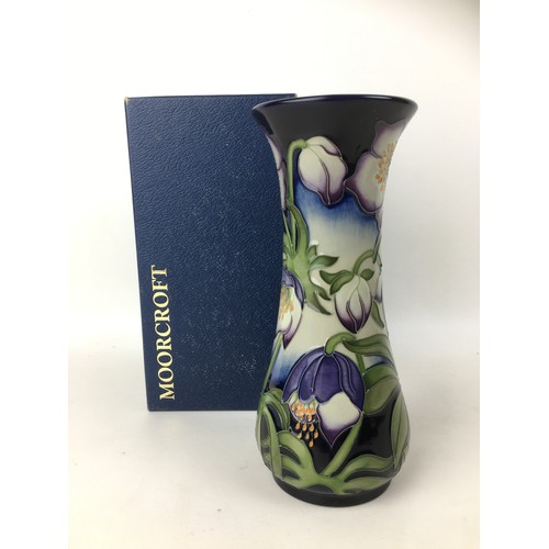 31 - A Moorcroft pottery vase with Festival flowers pattern, of flared form, with impressed marks to base... 
