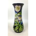 A Moorcroft pottery vase with Festival flowers pattern, of flared form, with impressed marks to base... 