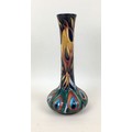 A Moorcroft pottery “Flames of the Phoenix” bottle vase, with impressed marks to base and signed by ... 