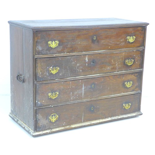 318 - An early 18th century oak chest of four drawers, with brass handles and lock plates, black metal han... 