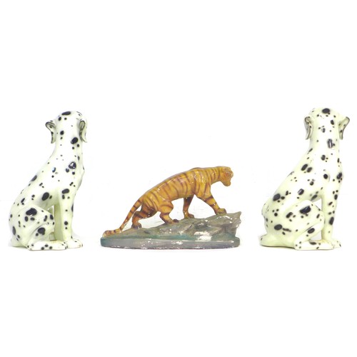 77 - A pair of modern Italian ceramic figures, modelled as seated Dalmations, each 33 by 27 by 42cm high,... 