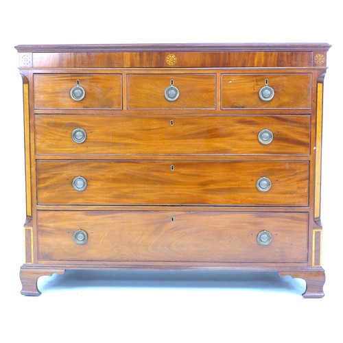 301 - A George III mahogany chest of drawers, crossbanded frieze inlaid with three marquetry roundels over... 