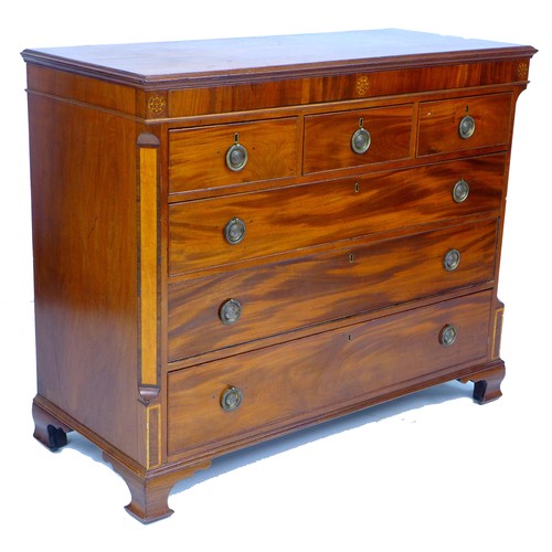 301 - A George III mahogany chest of drawers, crossbanded frieze inlaid with three marquetry roundels over... 