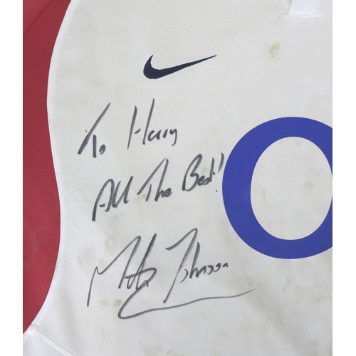 129 - A 2005 England Rugby Team shirt, signed in black marker 'To Harry, All The Best, Martin Johnson', an... 