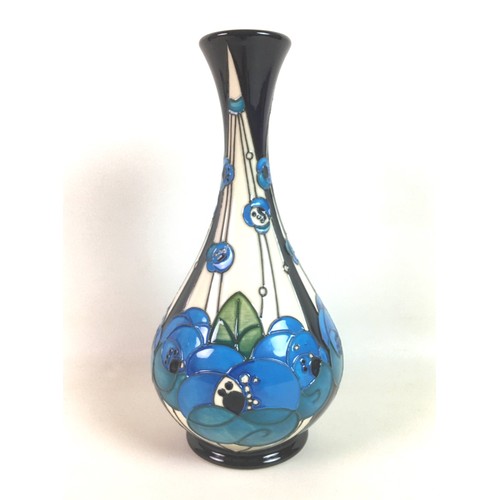 28 - A Moorcroft pottery bottle vase in Rennie rose blue pattern, designed by Rachel Bishop with impresse... 