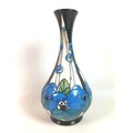 A Moorcroft pottery bottle vase in Rennie rose blue pattern, designed by Rachel Bishop with impresse... 