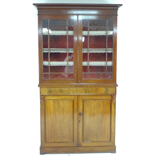 302 - A late Victorian mahogany glazed bookcase, twin glazed doors enclosing shelves, the base section wit... 