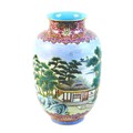 A Chinese famille rose porcelain vase, mid 20th century, decorated with a continuous scene of buildi... 