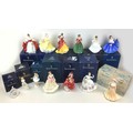 A group of thirteen Royal Doulton and Coalport figurines, all most boxed, comprising twelve Royal Do... 