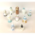 A collection of ten Royal Worcester porcelain snuffers, comprising Punch, 9cm, Budge, 10.5cm, Old Wo... 