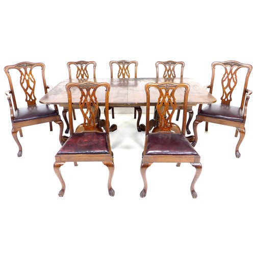 305 - A modern oak twin pedestal extending dining table, in George II style, the rectangular surface with ... 