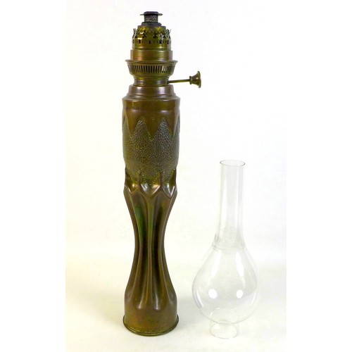 276 - An Art Nouveau/Secessionist trench art oil lamp, of organic, fluted waisted form below planished ovo... 