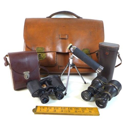 45 - A group of optical instruments, including a pair of black morocco leather bound binoculars, circa 19... 