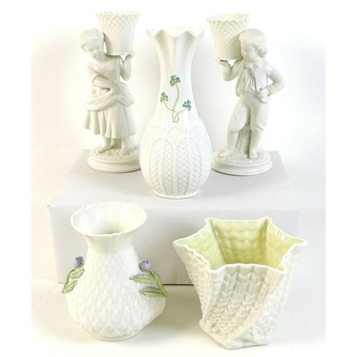 32 - A collection of Belleek pottery, comprising Girl Basket Bearer and Boy Basket Bearer (a/f chip to ba... 
