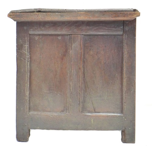 304 - An 18th century oak chest, lift top, candle compartment to one side, loop hinges, three panel front,... 