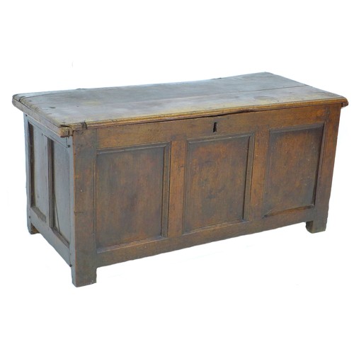 304 - An 18th century oak chest, lift top, candle compartment to one side, loop hinges, three panel front,... 