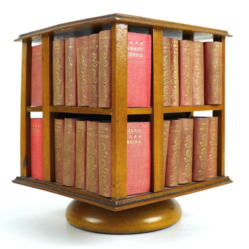 92 - A miniature table top revolving bookcase, containing a set of forty miniature Shakespeare plays, in ... 