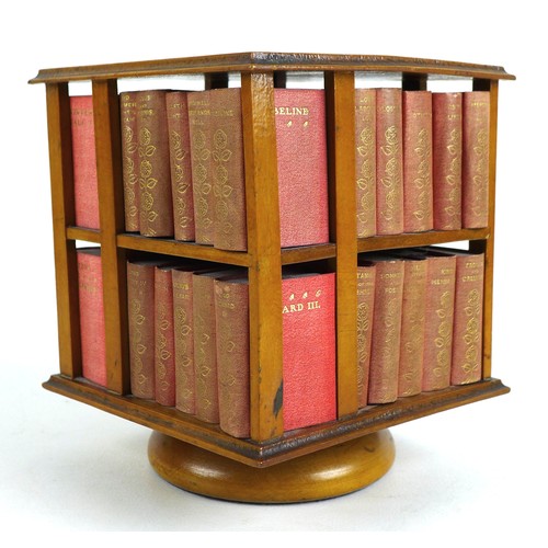 92 - A miniature table top revolving bookcase, containing a set of forty miniature Shakespeare plays, in ... 