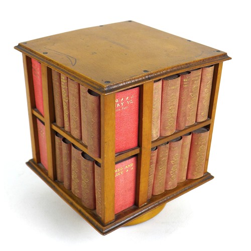 92 - A miniature table top revolving bookcase, containing a set of forty miniature Shakespeare plays, in ... 